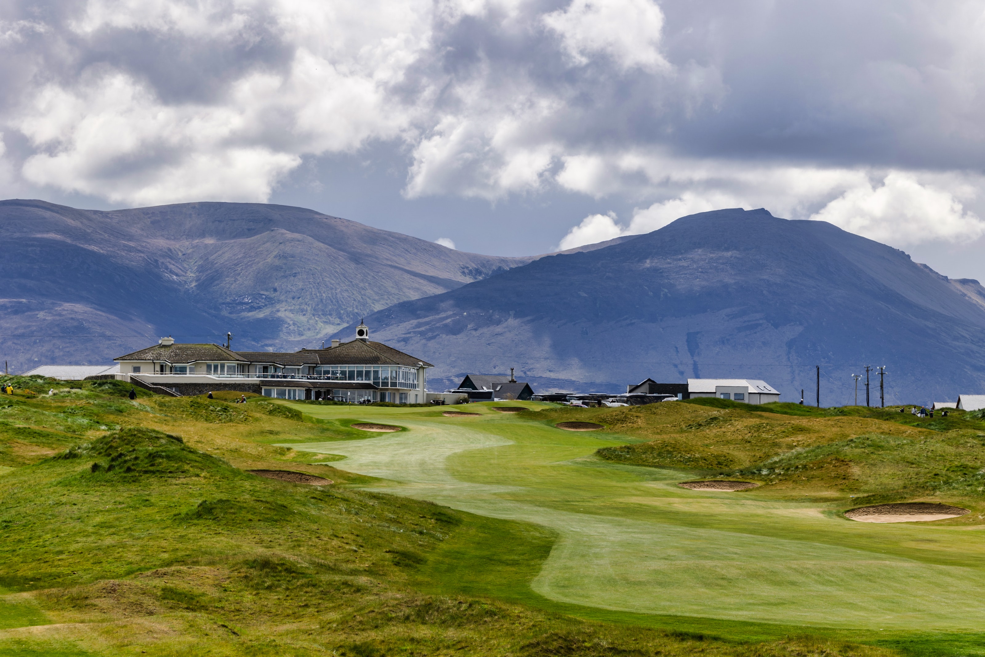 18th green and clubhouse at Tralee Golf Club with the Slieve Mish mountains